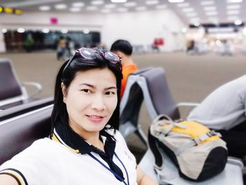 Portrait of smiling woman in bus