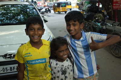 Portrait of smiling boy with children in bus