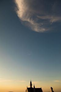 Low angle view of silhouette building against sky during sunset