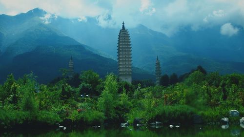 Scenic view of mountains against cloudy sky