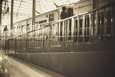 Rear view of man at railroad station