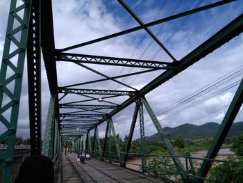 View of bridge against cloudy sky