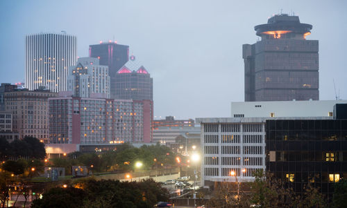 Buildings in city at night