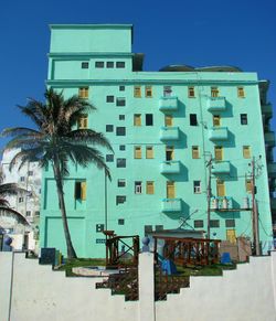 Low angle view of building against clear blue sky