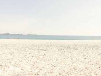 Scenic view of beach against clear sky