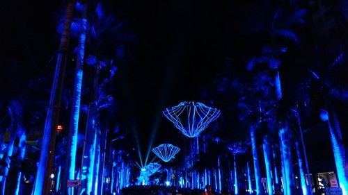 Low angle view of illuminated ferris wheel