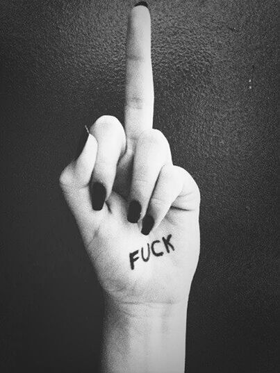 person, human finger, part of, studio shot, holding, close-up, text, indoors, western script, cropped, communication, black background, showing, lifestyles, love, unrecognizable person