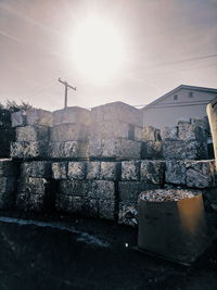 Snow on retaining wall against sky