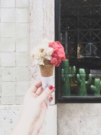 Cropped image of hand holding ice cream