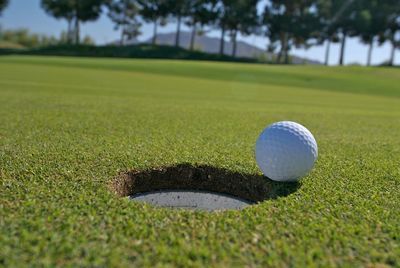 Close-up of golf ball on grass