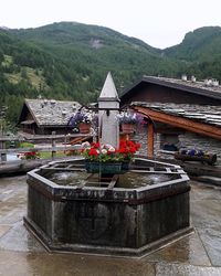 Temple by building against sky