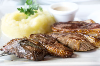 Close-up of roasted meat on table