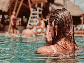 Portrait of woman swimming in pool