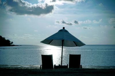 Built structure on beach against sky