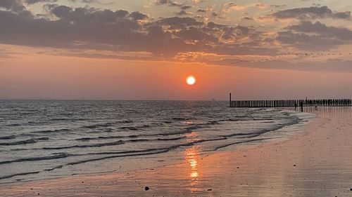 Scenic view of sea against sky during sunset