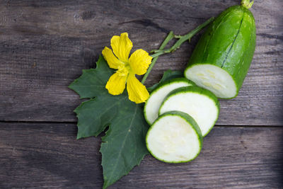 High angle view of chopped fruits and leaves on table