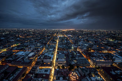 Aerial view of illuminated cityscape at night