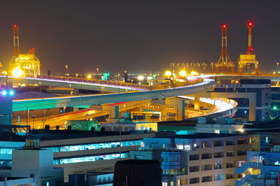 Illuminated buildings in city at night