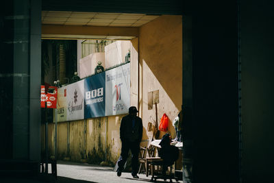 People in front of building