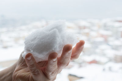 Cropped image of hand holding soap 