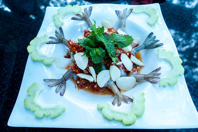 High angle view of fruits in plate on table