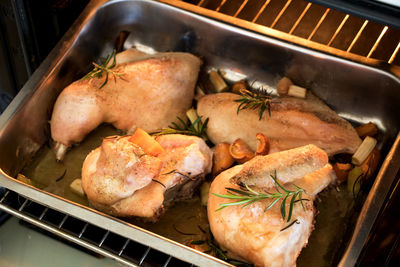 High angle view of meat on barbecue grill