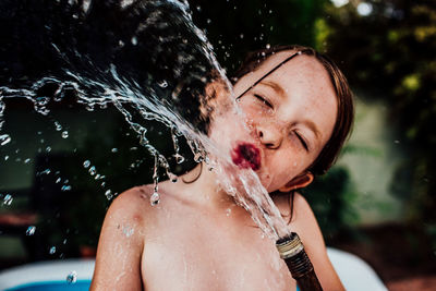 Portrait of shirtless man in water