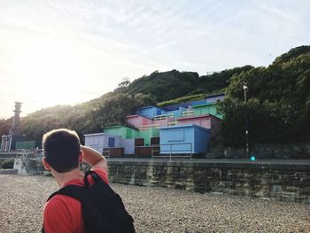 Rear view of boy against sky