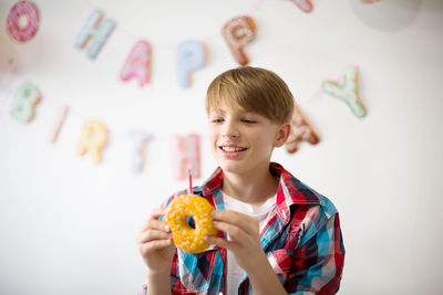 Portrait of woman holding watermelon