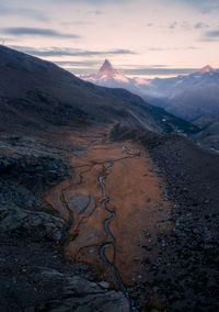 Scenic view of mountains against sky during sunset