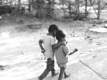 High angle view of boys walking on street