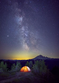 A tent is under the milky way on the top of a mountain, washington, us