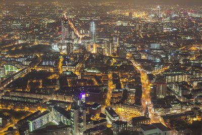 High angle view of city lit up at night
