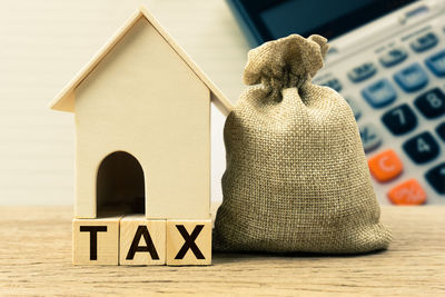 Close-up of stuffed toy on house against building