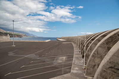 Bridge over sea against sky