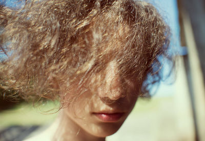 Close-up of young woman with hair on face