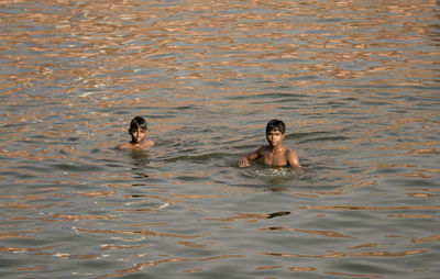 Children swimming in water