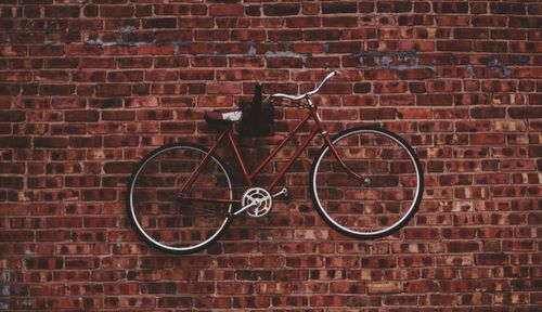 Bicycle against brick wall