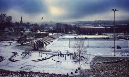 Scenic view of frozen town against sky