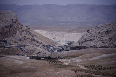 Scenic view of desert against mountain range