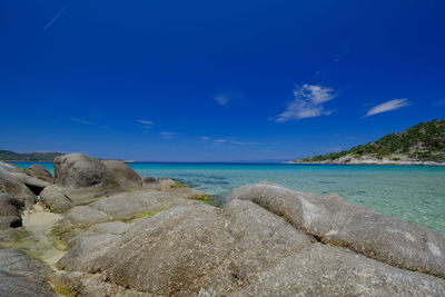 Scenic view of sea against blue sky