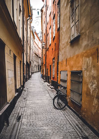 Narrow alley amidst buildings in city