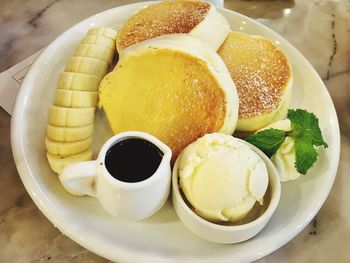 Close-up of breakfast served in plate on table