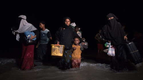 People standing at night