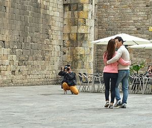 Young couple sitting outdoors