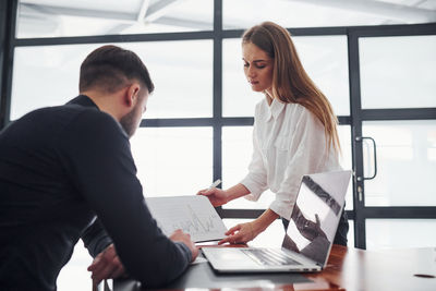 Business colleagues working in office