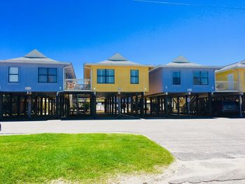 Residential buildings against blue sky