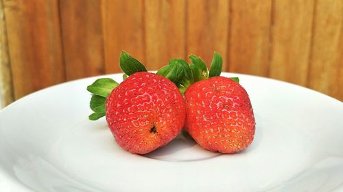 Close-up of strawberries in plate on table