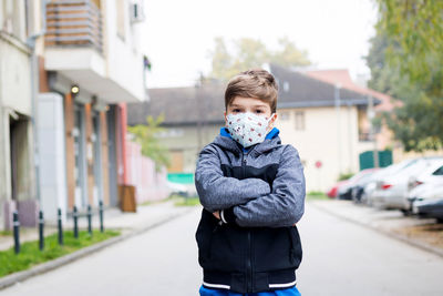 Portrait of boy on street in city