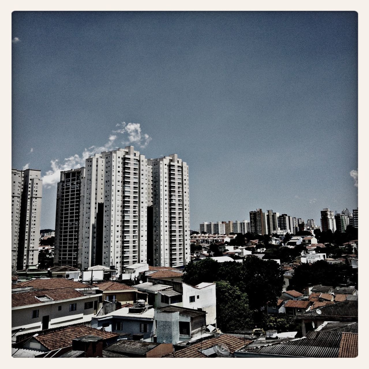 transfer print, building exterior, architecture, built structure, auto post production filter, low angle view, city, clear sky, tall - high, sky, building, residential building, outdoors, tower, day, residential structure, copy space, tall, no people, skyscraper